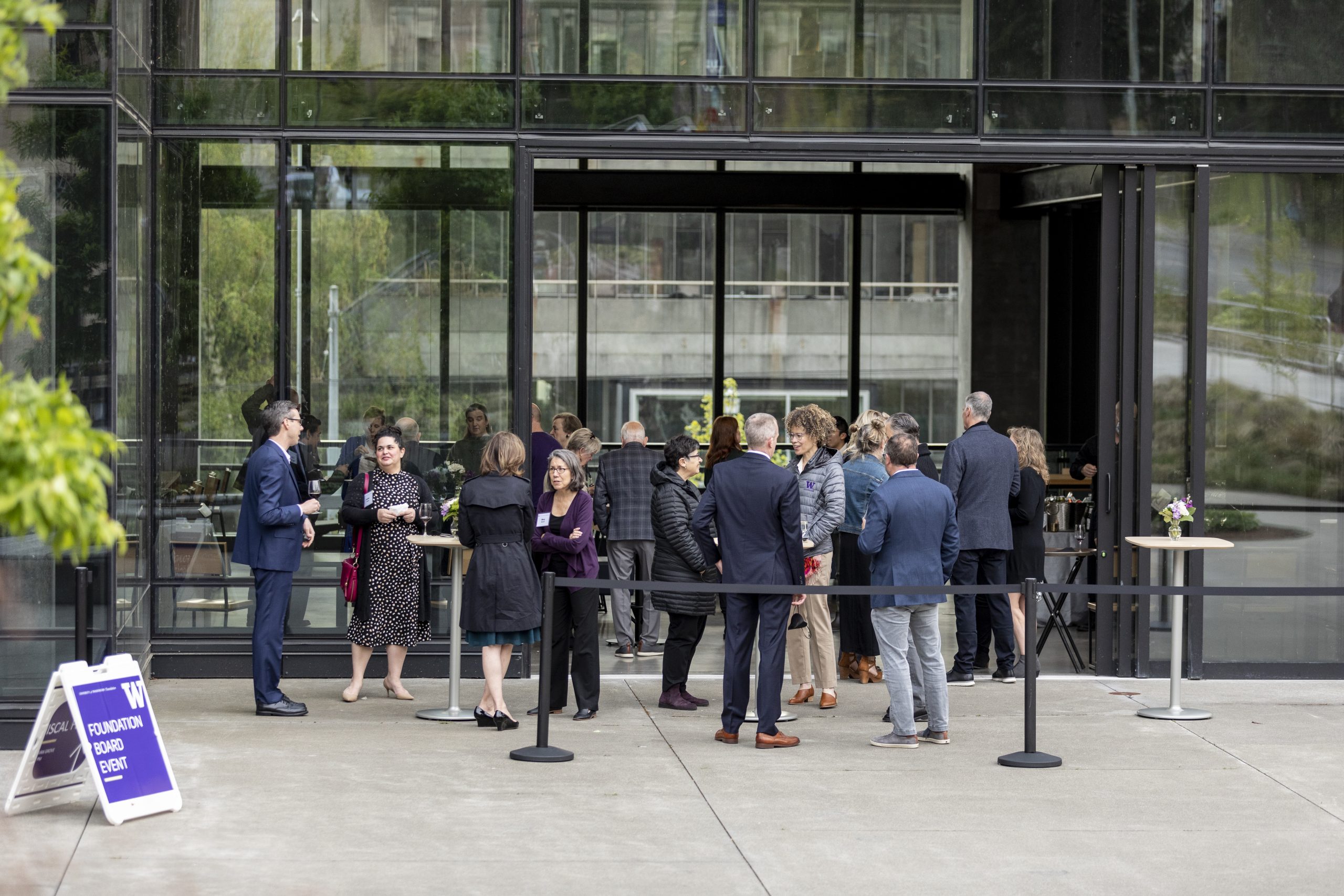 outside shot of board members socializing before a meeting
